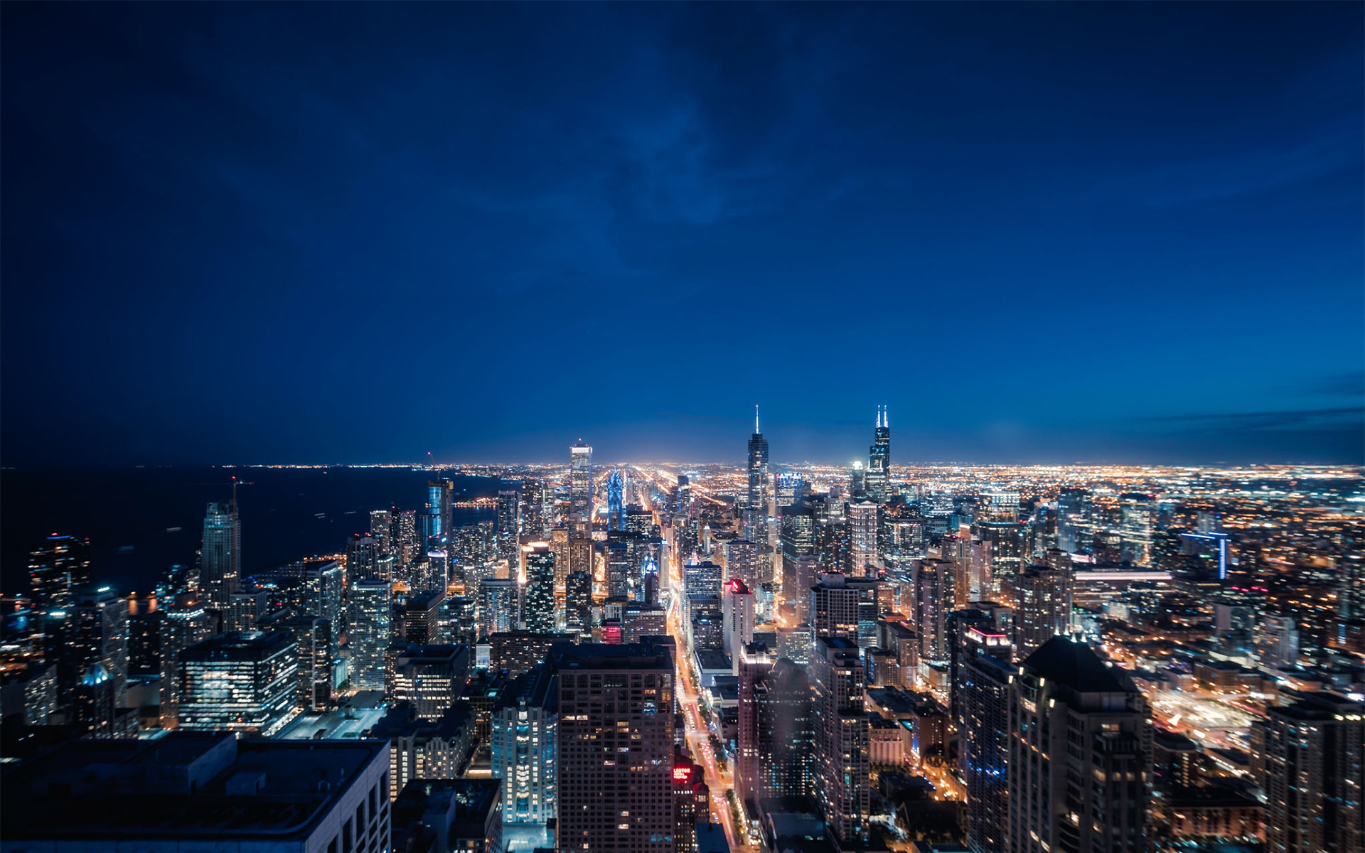 https://gayvallartatravel.com/wp-content/uploads/2021/01/1160442138-Aerial-View-of-Chicago-cityscape-skyline-at-Night.jpg